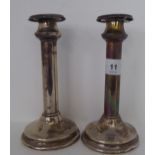 A pair of silver candlesticks, on loaded bases  Chester 1926  7"h