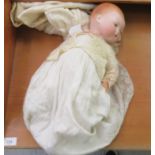 An early 20thC Armand Marseille bisque head doll with painted features and weighted, sleeping