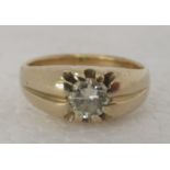 An 18ct gold gypsy ring, set with a single central diamond