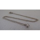 A silver coloured metal claw set single stone diamond pendant, on a fine neckchain and ring bolt