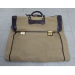 A Gucci brown fabric suit carrying case