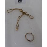 A bi-coloured gold coloured metal and cubic zirconia set pendant, on a fine, flexible link neckchain