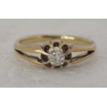 An 18ct gold gypsy ring, set with a single diamond