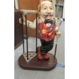 A modern composition snooker cue stand, fashioned as a man wearing a waistcoat  28"h