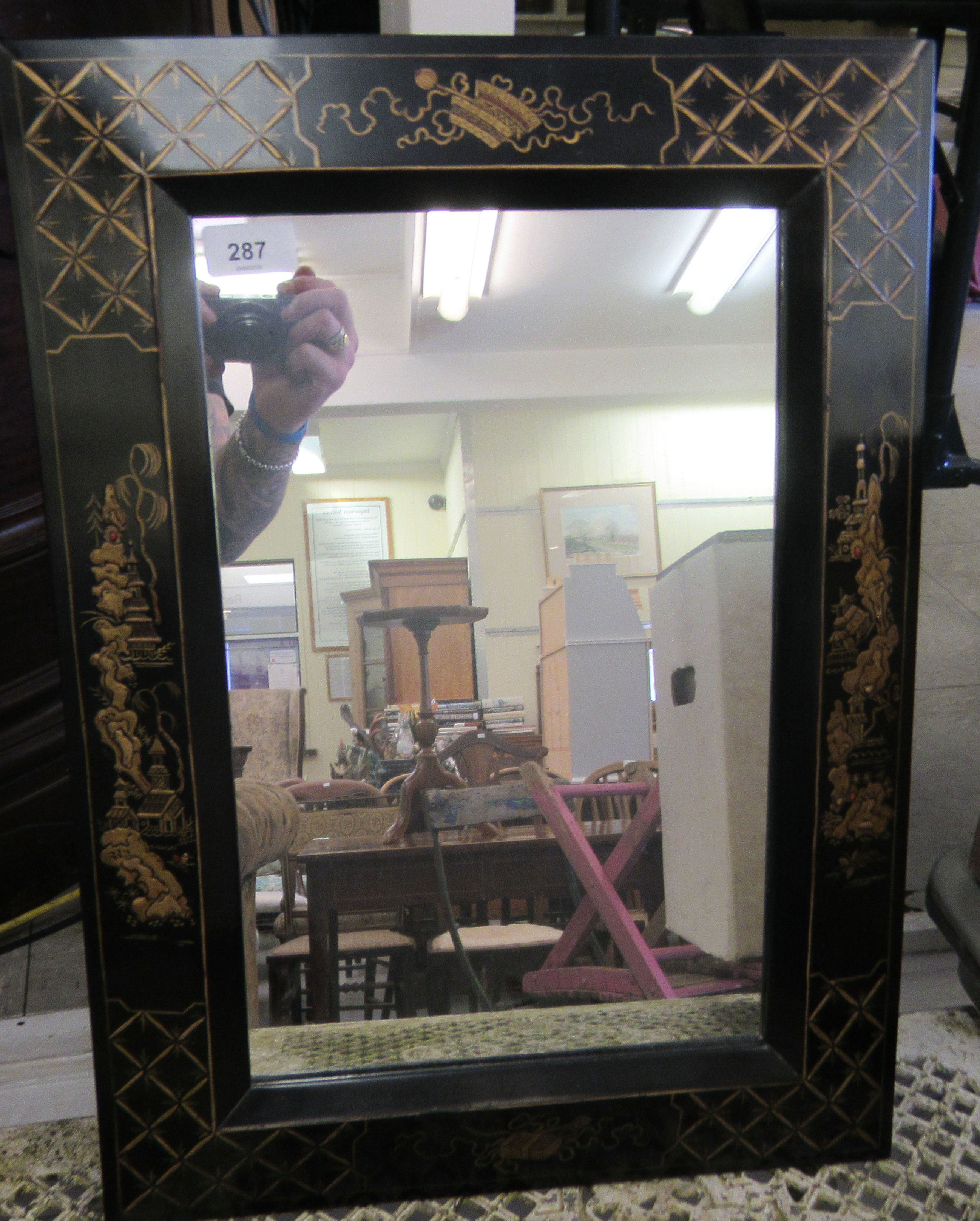 A 20thC mirror, the plate set in a black lacquered frame, decorated in chinoiserie taste  16" x 21"