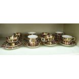 Eight Royal Crown Derby china cups and saucers, decorated in the Imari palette