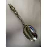 An 18thC Dutch silver coloured metal presentation spoon with an engraved bowl back and figure on the