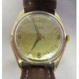 A vintage Omega 9ct gold cased wristwatch, the movement with sweeping seconds, faced by a gilded