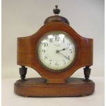 An Edwardian satinwood string inlaid, mahogany cased navette shaped mantel timepiece with a domed