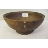 An antique Chinese earthenware bowl with incised frieze decoration, on a splayed footrim  7"dia