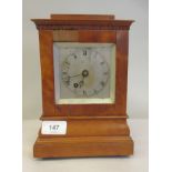 A 19thC fruitwood cased bracket clock with straight sides and a platform top, on an ogee plinth; the