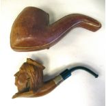 A late 19thC smoker's pipe, the carved wooden bowl featuring Queen Victoria's crowned head on the