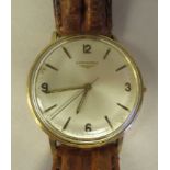 A 1970s Longines gold coloured metal cased wristwatch, the movement with sweeping seconds, faced
