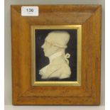 A 19thC carved wax head and shoulders profile portrait miniature, believed to be that of Marquis