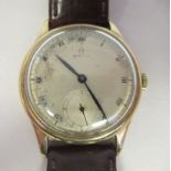 A vintage Omega 9ct gold cased wristwatch, faced by a silvered steel Roman dial, incorporating a
