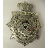 A military helmet plate for 1st Battalion Sherwood Foresters with a blue enamel centre (Please Note: