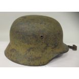 A World War II German army steel helmet with a single decal, liner and chinstrap  (Please Note: this