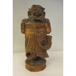 A late 19th/early 20thC Sino-European carved and stained jar and cover, depicting a standing,