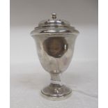 A George III silver sander of pedestal vase design, the decoratively pierced cover with a ball