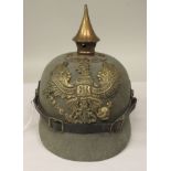 A Great War period German moulded khaki coloured felt pickelhaube with a hide liner and chinstrap (