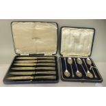 A set of six silver seal terminal coffee spoons  cased; and a set of six silver tea knives