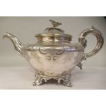 A William IV silver foliate scroll engraved teapot of squat, bulbous form with a S-shape spout, a