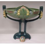 An Art Deco two tone blue/green glazed pottery table centrepiece oval bowl, elevated on a twin