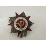 A World War II Soviet Russian enamel on white 'Order of the Patriotic War' medal, enamel on white (