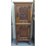 An early 20thC Flemish inspired carved oak, two door cupboard, raised on block feet  51"h  20"w