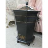 An early 19thC style black painted and gilded iron coal bin of tapered, octagonal form with twin