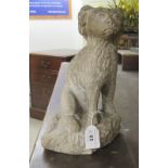 A carved stone model, a seated King Charles spaniel  11"h