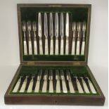 A set of twelve silver fruit knives and forks, on ferrules and mother-of-pearl handles  Sheffield