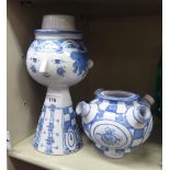 A Bjorn Wiinblad painted blue and white pottery, two part vase  bears painted marks & initials  14"h
