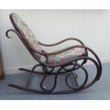 An early 20thC stained beech framed, bentwood style rocking chair of scrolled design with stud