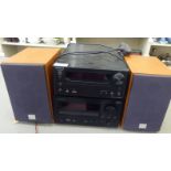 An Onkyo CD receiver, model no.CR-545UKD; and another CR-555 DAB model; and two Sony speakers