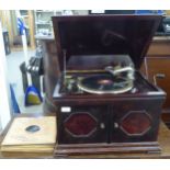 A 1930s (possibly Saturn) tabletop gramophone with a Saturn pick-up, the mahogany case with a hinged