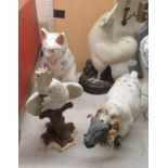 Four modern ceramic models of animals and birds: to include a cockatoo, perched on a log  15"h;