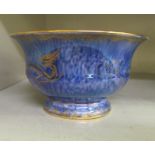 A Wedgwood sponged blue and cream coloured, lustre glazed footed bowl, decorated in gilt and colours