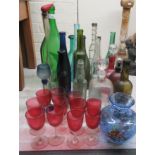 Glassware: to include a clear and cranberry coloured decanter and stopper