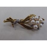 A 9ct gold brooch, fashioned as a bouquet, set with pearls and diamonds
