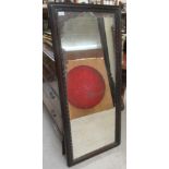 A 19thC mirror, the shaped plate set in a Chinese inspired mahogany frame  22" x 51"