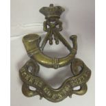 A Queen's County Rifles cap badge (Please Note: this lot is subject to the statement made in the