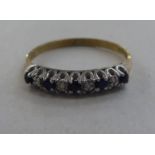 A 9ct gold eternity ring, set with alternating sapphires and diamonds