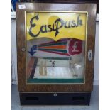A mid 20thC electric, easy push coin arcade game  27"h  20"w