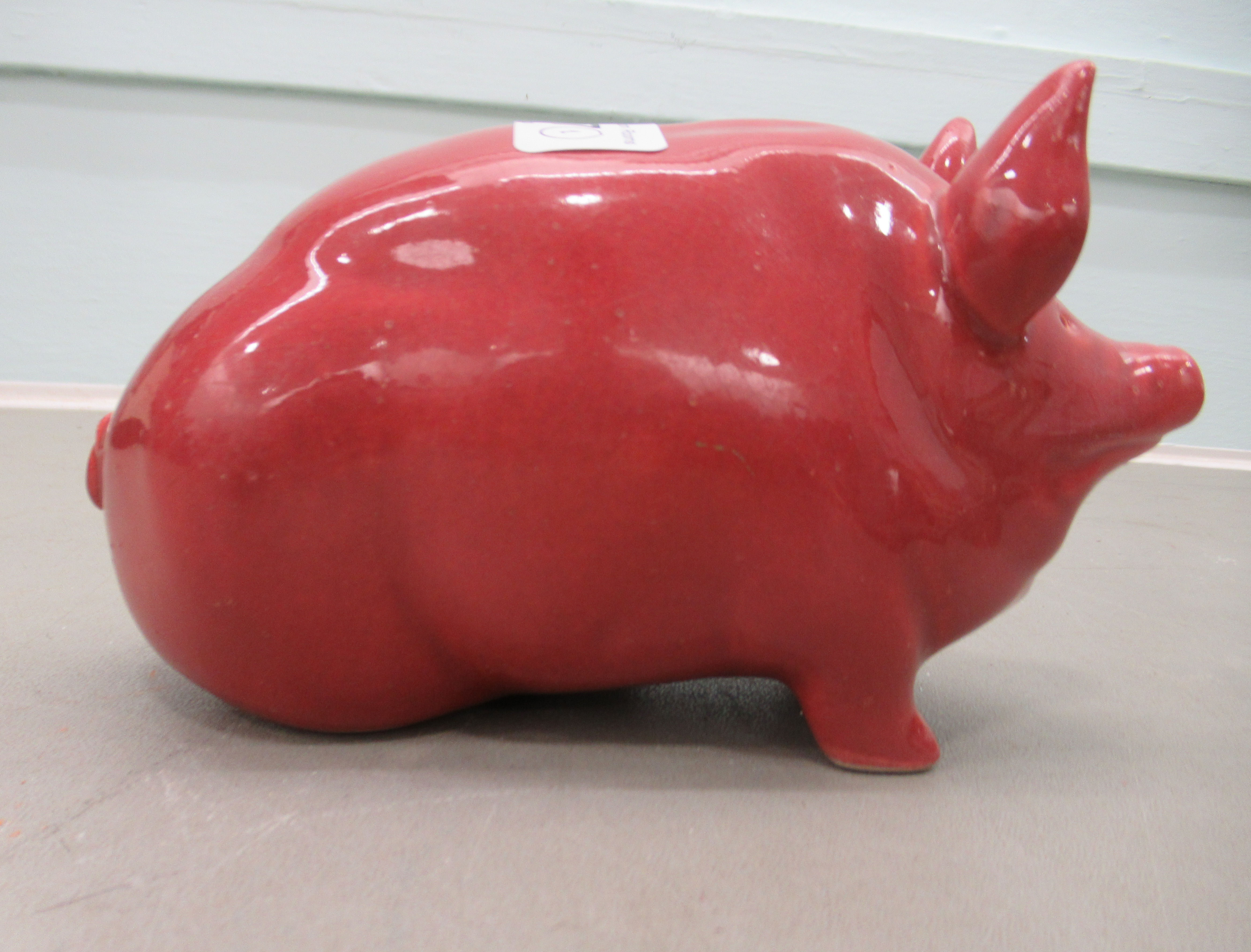 A Wemyss ware red glazed china model pig  4"h