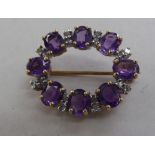 A 9ct gold brooch, set with alternating amethysts and diamonds