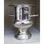 A silver plated pedestal urn design, twin handled Champagne bucket  10"h