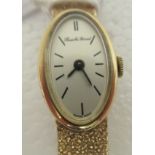 A lady's Bueche Girod 9ct gold, oval cased bracelet wristwatch, faced by a baton dial