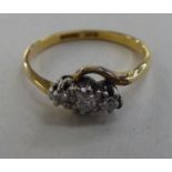 An 18ct gold ring, set with three diamonds