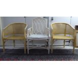 A pair of simulated bamboo, cream wash painted, caned, framed chairs; and another dissimilar